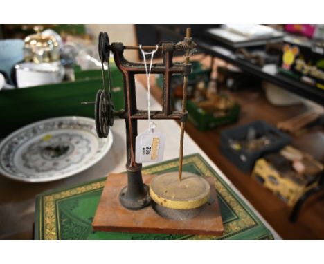 Small vintage instrument with pulley wheels  