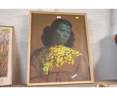 A framed print of oriental lady wearing yellow clothing