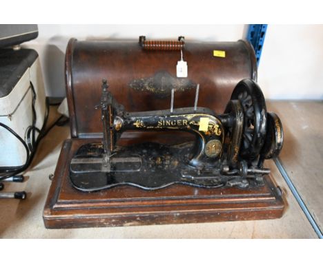 A vintage cased Singer sewing machine 