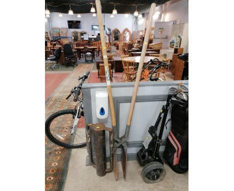 A post knocker and post hole shovel 