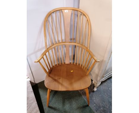 A light oak Ercol Windsor chair with carver arms