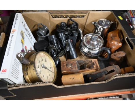 A box of vintage binoculars to include Alpim, two pewter measures, two woodworking planes and silver plated ware