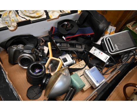 A box of cameras and accessories including Canon lens, negative scanner, vintage flashes 