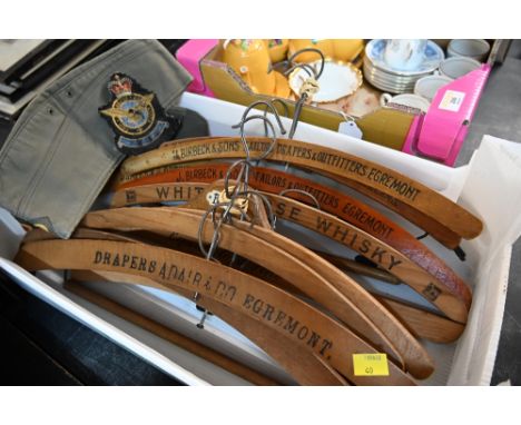 A collection of vintage Egremont made coat hangers and militaria