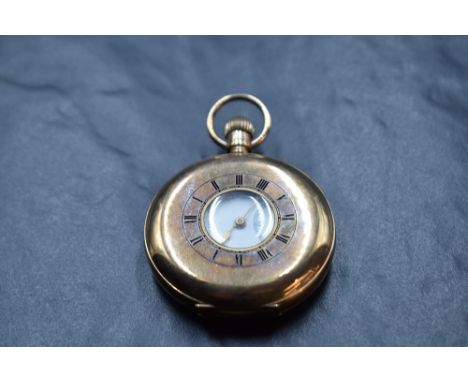 A 9ct rose gold half hunter top wound pocket watch by Kendal &amp; Dent, London watch makers to the Admiralty, having Arabic 