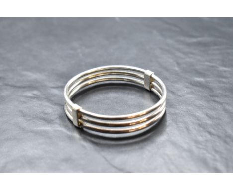 A triple bar continental silver bangle