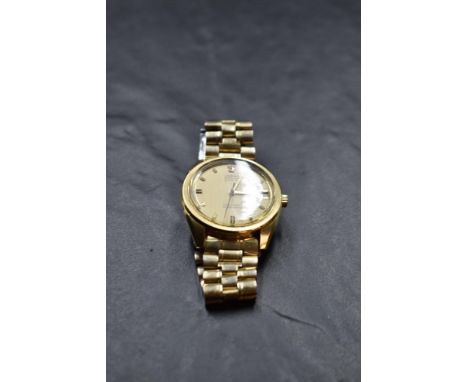 A gent's Omega Electronic F300HZ Seamaster chronometer gold plated wrist watch having baton dial with date aperture to champa