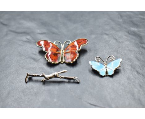 A Norwegian silver and enamel butterfly brooch by David Anderson, a silver hunting brooch in the form of fox and crop, and a 