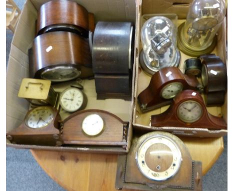 A selection of clocks in two boxes including clocks in the dome, mahogany cased mantle clocks, carriage clock, oak clocks, et