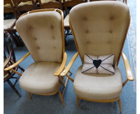 A pair of Ercol Windsor elm and beech armchairs, with stick backs, Ercol labels, with cushions