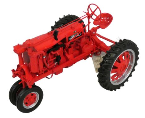 A 1:16 scale ERTL Farmall model 'F-20' narrow front tractor, together with a 'Farmall Farming' booklet, The Franklin Mint 'Co