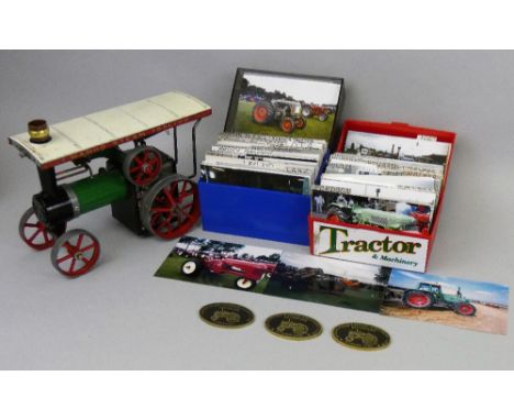A Mamod TE1A live steam tractor, the tin plate body with green and black paintwork, measures 28 x 15 x 18cm, together with tw