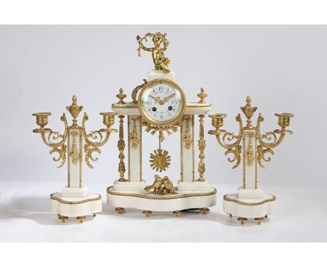 A French white marble and gilt brass three piece clock garniture, the dial surmounted with putti, having white enamel dial wi