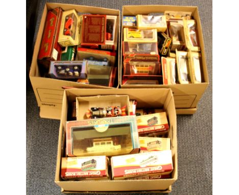 Three boxes of diecast model vehicles.