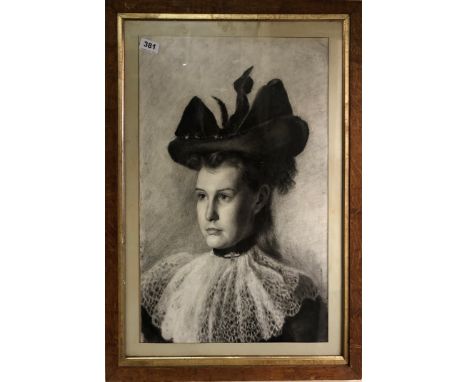 A Victorian framed charcoal portrait of a girl wearing a bonnet, frame size 51 x 67cm.