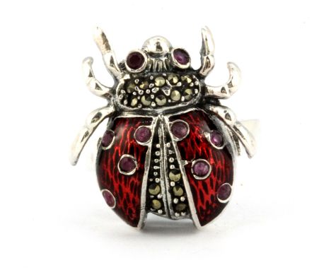 A 925 silver and marcasite enamelled spider shaped ring set with rubies, (P).