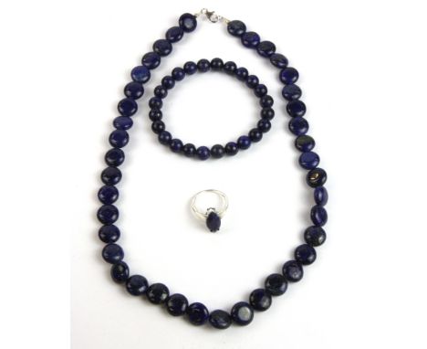 A necklace, bracelet and ring of lapis lazuli beads.