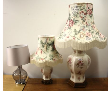 Two porcelain table lamps and a further glass table lamp and shade, tallest H. 90cm.