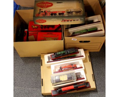 Two boxes of matchboxes of Yesteryear and model trains.