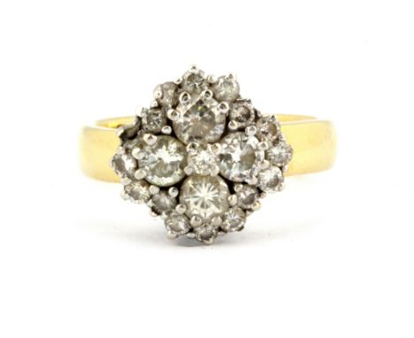 An 18ct yellow and white gold diamond set cluster ring, approx. 1.20ct overall, (one diamond missing), (O).