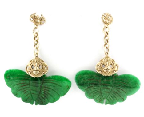 A pair of Chinese white metal (tested low grade silver) drop earrings set with carved jade, L. 6.5cm.