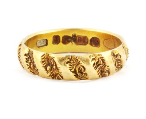 An 18ct yellow gold patterned ring, W. 3.7g (M).