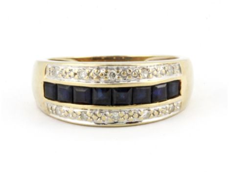 A yellow metal (tested 9ct yellow gold) sapphire and diamond set ring, (P).