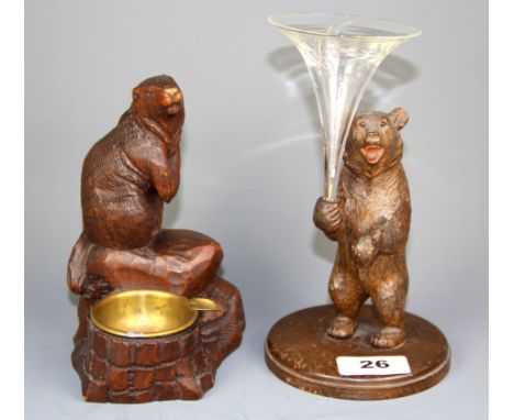 A carved Black Forest inkwell figure of a beaver, together with a further Black Forest carved wooden figure of a bear holding