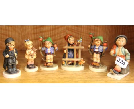 Six Goebel children figurines.