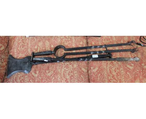 A set of three large wrought iron fire tools
