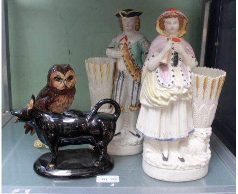 A Royal Doulton Scotch Whisky owl decanter, a Jackfield cow creamer jug and a pair of figures