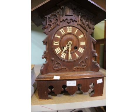 A late 19th century black forest cuckoo mantel clock