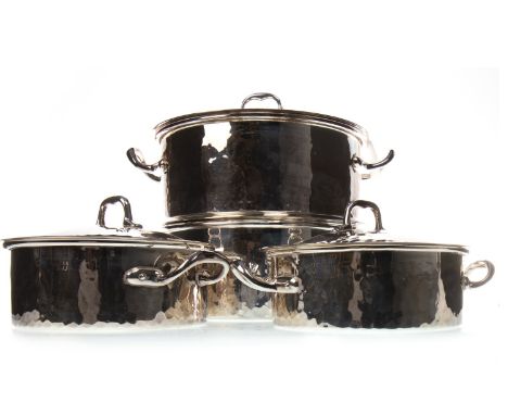 TWO PAIRS OF SILVER PLATED LIDDED SERVING DISHES BY CHRISTIAN DIOR, with hammered decoration, 27cm and 21cm wide including ha