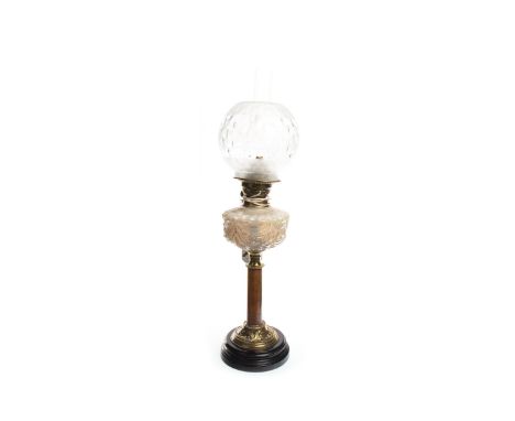 VICTORIAN OIL LAMP, the opalescent reservoir above a brass column and circular foot, with etched globe shade and chimney, 68c