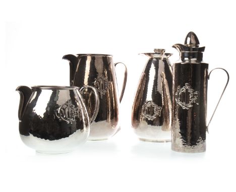 TWO SILVER PLATED WATER JUGS AND TWO INSULATED JUGS BY CHRISTIAN DIOR, the jugs with stoppers, the tallest 30.5cm high