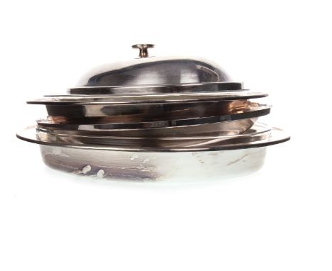 TWO SILVER PLATED OVAL SERVING DISHES BY CHRISTIAN DIOR, with detachable lids and glass liners, 45.5cm and 41cm wide