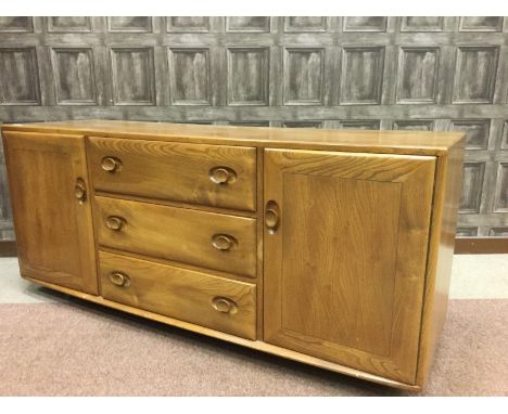 ERCOL LIGHT OAK SIDEBOARD, with three central drawers flanked by panel doors enclosing a shelved interior, 156cm wide, 68cm h