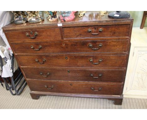 A late 18th century oak six drawer chest, retaining period swan neck handles &amp; blue paper linings, on four bracket feet, 