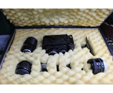 An aluminium flight case, containing a Yashica camera &amp; lenses
