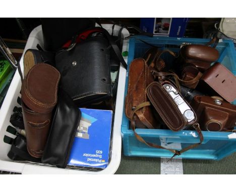 A large collection of vintage cameras, binoculars, etc.
