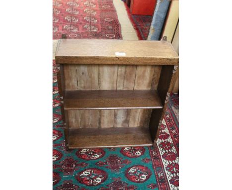 A 19th century oak wall shelf, chip carved sides, 47cm wide