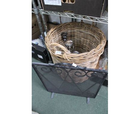 A log basket,&nbsp;candelabra and firescreen
