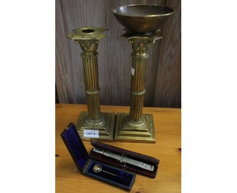 Pair of brass candlesticks, scales and a fox mask tie pin