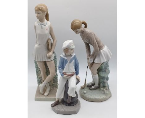 3 LLADRO'S - BOY HOLDING YACHT, GIRL PLAYING GOLF AND GIRL PLAYING TENNIS