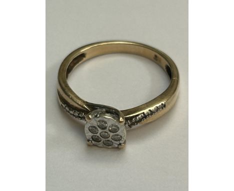 9ct Gold dress ring set with 7 small cut diamonds Weight 2.6g Size N