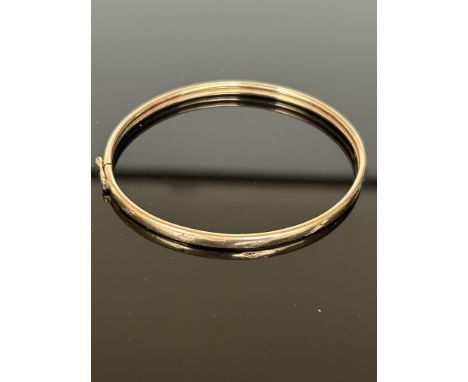 Yellow metal bangle 