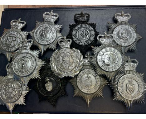 Collection of mainly helmet badges (11)