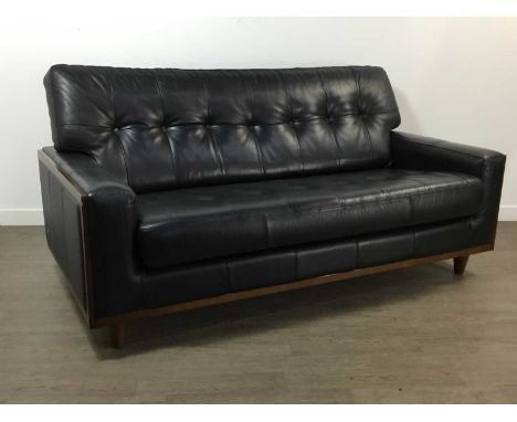 G-PLAN, MODEL 59 THREE SEAT SETTEE, CONTEMPORARY upholstered in button back black leather, walnut framed sides, on tapered co