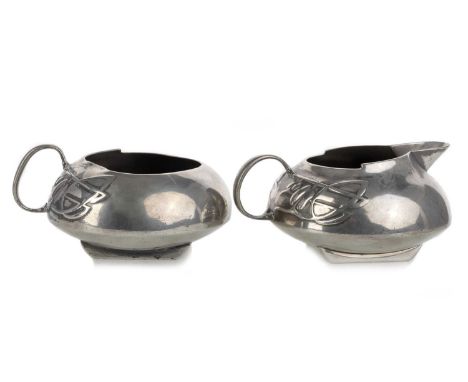 ARCHIBALD KNOX (BRITISH, 18644-1933) FOR LIBERTY & CO., TUDRIC PEWTER CREAM JUG AND SUGAR BOWL, CIRCA 1900 each with hoop han