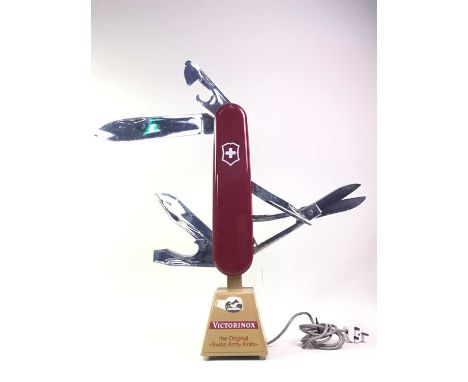 VICTORINOX SWISS ARMY KNIFE LARGE SHOP COUNTER DISPLAY, the knife with opening and retracting blades, over a tapered square b